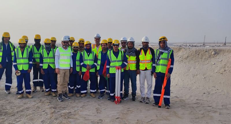 Site team in safety vests and helmets