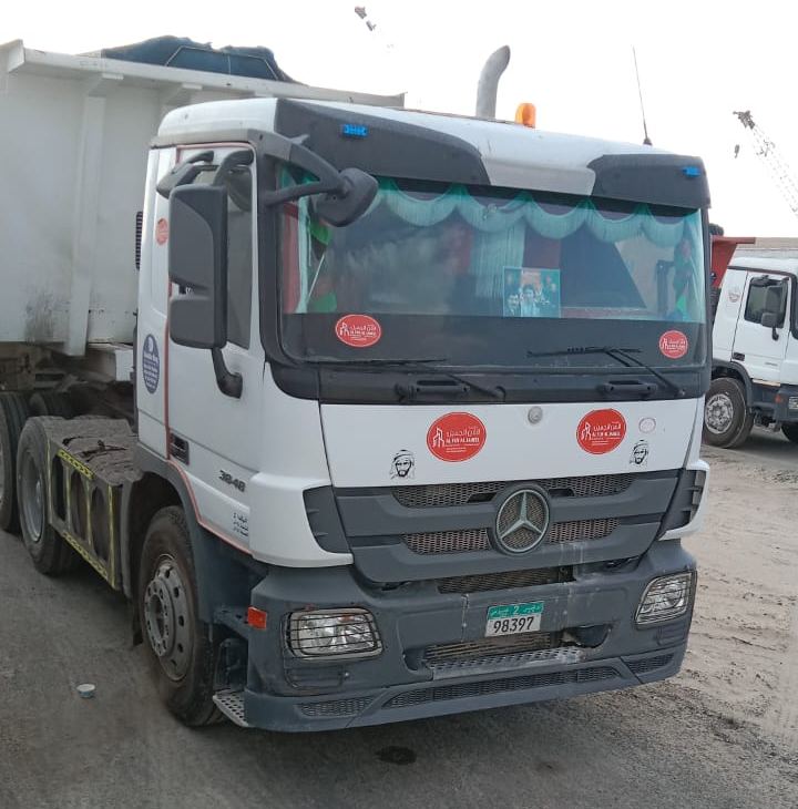 Company truck with tipper trailer and Al Fun Al Jameel stickers
